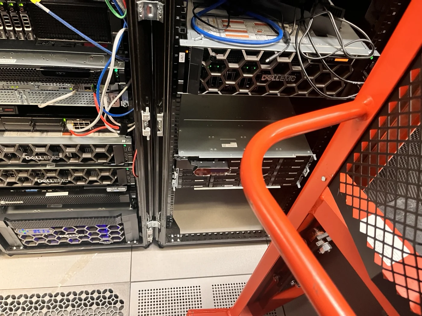Rack lift positioned beside the colocation cabinet during installation