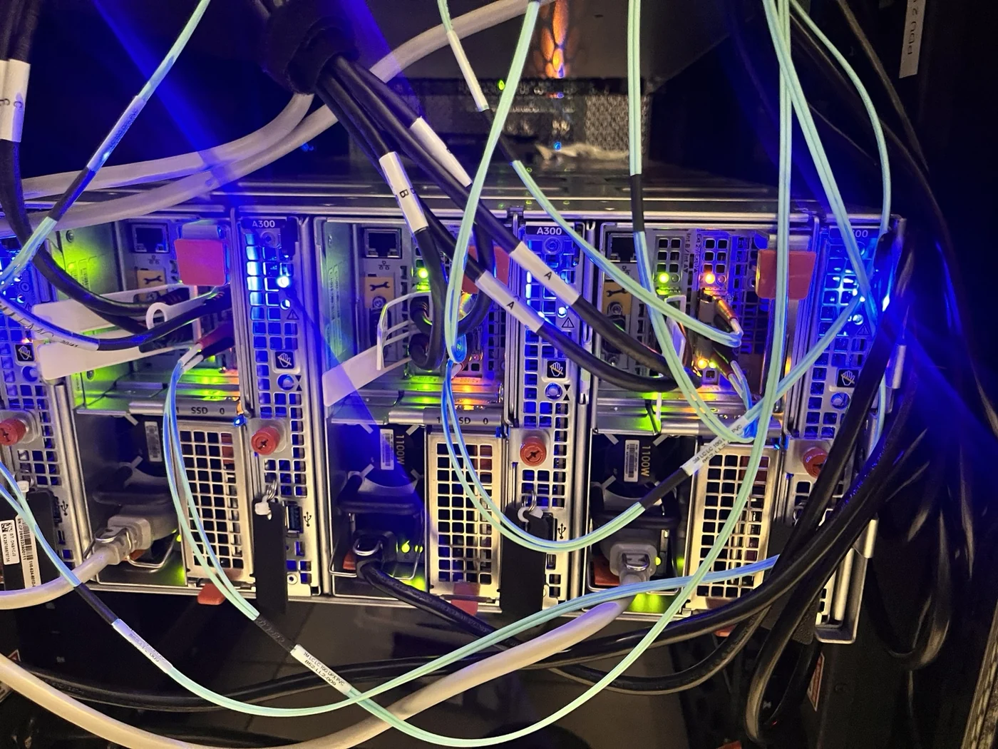 Rear power and network cabling connected to the four-node Isilon cluster